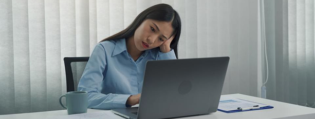 Tired woman at computer